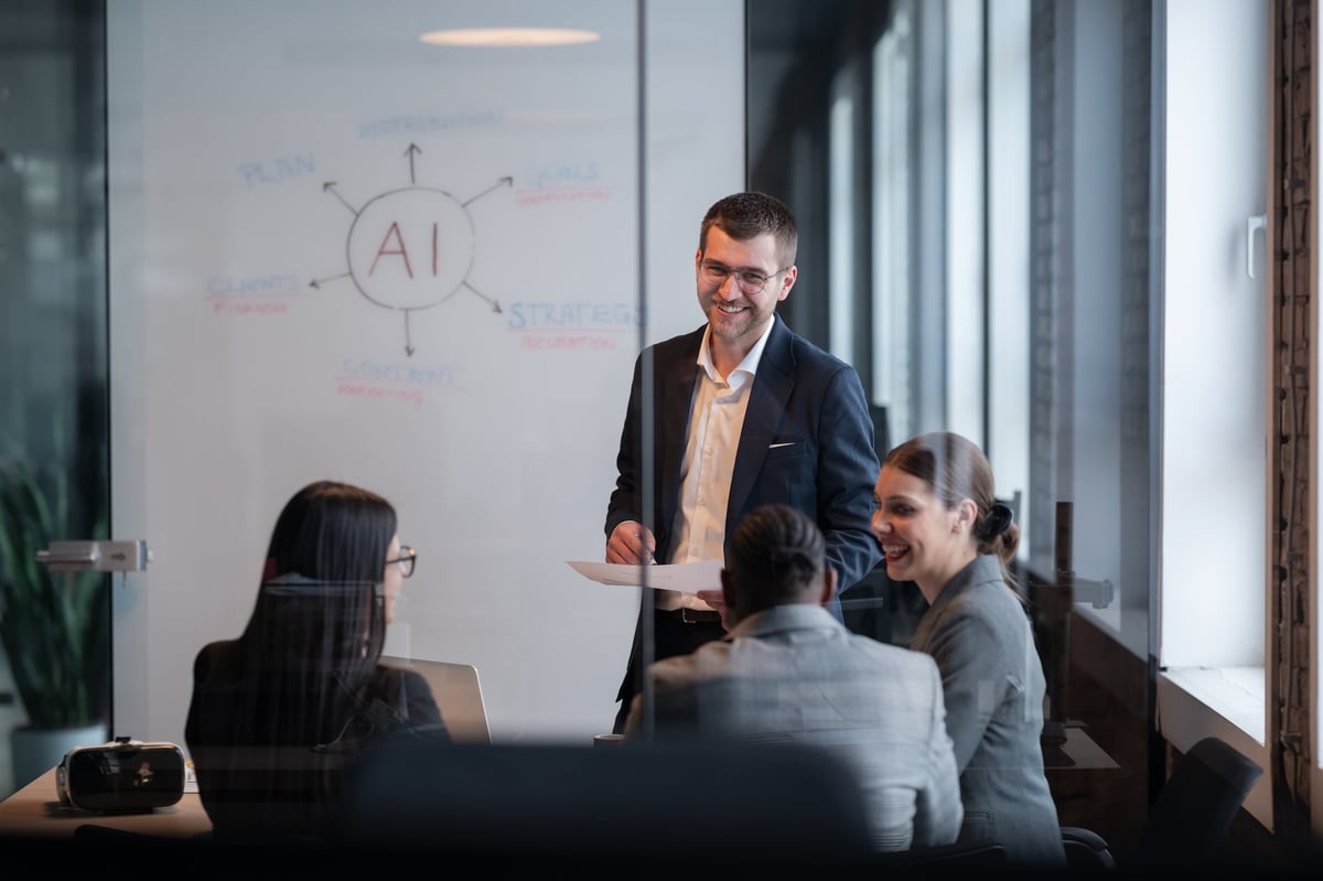 Diverse management team collaborating on strategy in a modern office